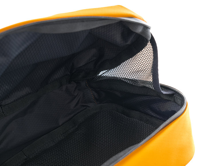 Open handlebar bag showing compartmentalized interior with mesh pockets for organized storage