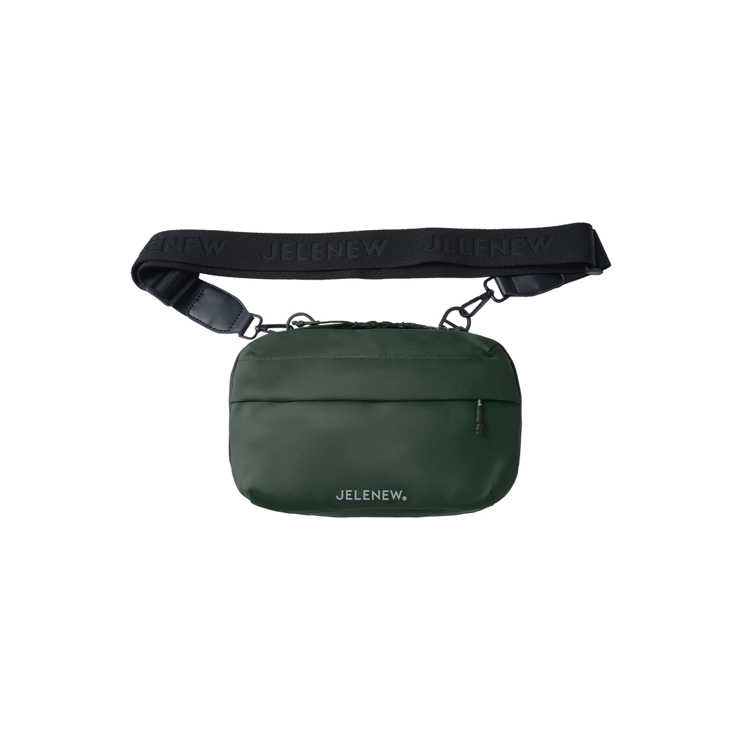 Compact green handlebar bag with adjustable black strap and multiple compartments for organized storage