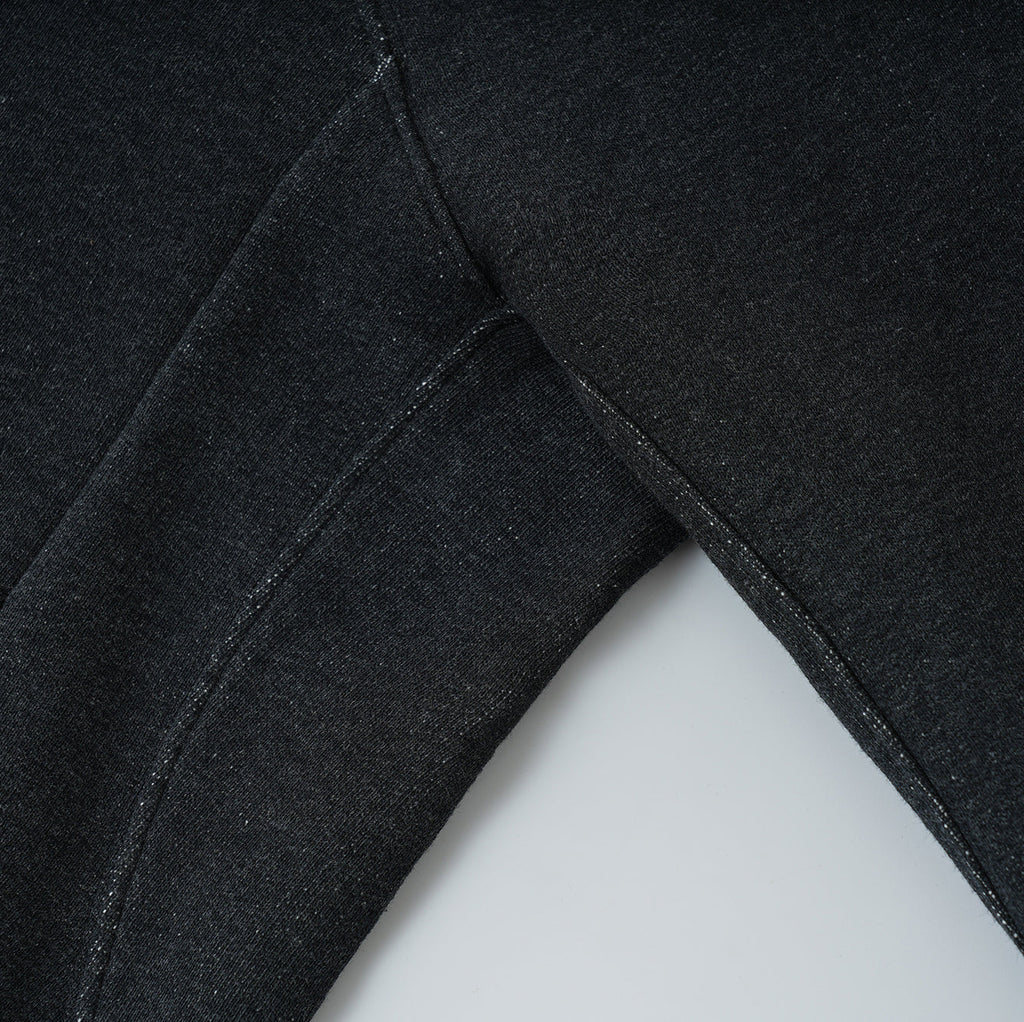 close-up of black Essentials Cotton Crewneck sweatshirt fabric and stitching detail