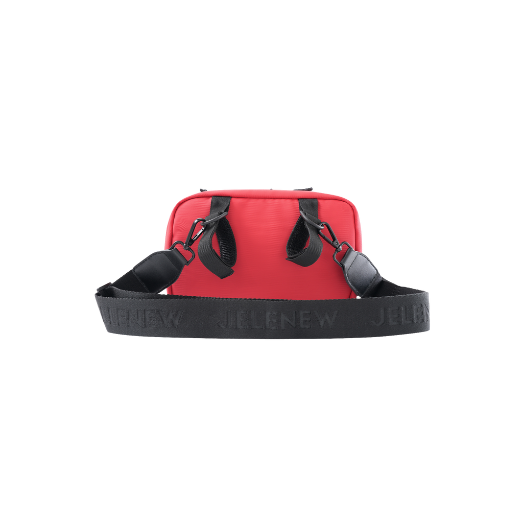 Red handlebar bag with adjustable black strap for organized storage