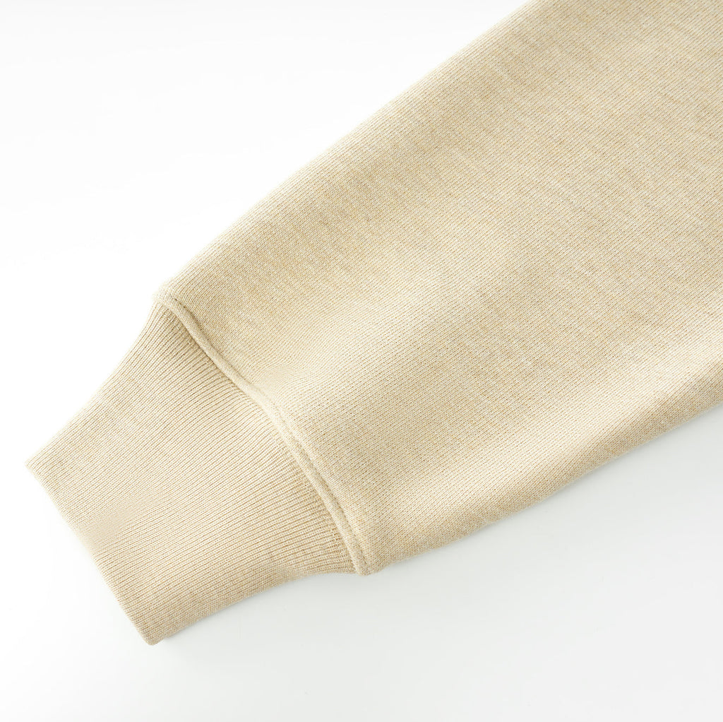 Beige Essentials Cotton Crewneck sweatshirt sleeve with ribbed cuff close-up