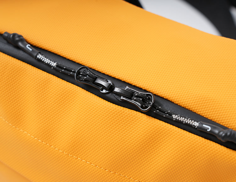 Close-up of a yellow handlebar bag zipper designed for easy access and organization