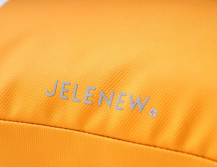 Close-up of bright orange JELENEW handlebar bag with textured fabric for organized storage and easy access.