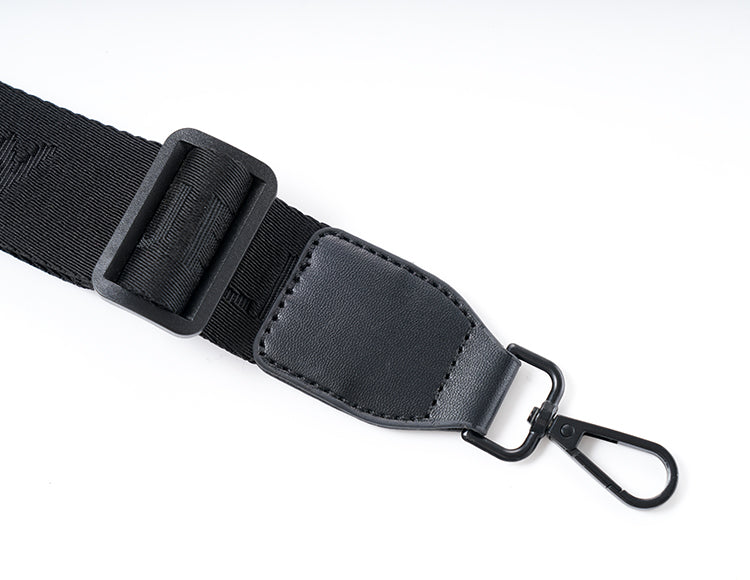 Adjustable strap with clip for handlebar bag attachment, black nylon and leather material