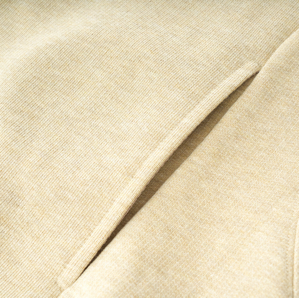 Essentials Cotton Crewneck beige fabric close-up showing texture and seam details
