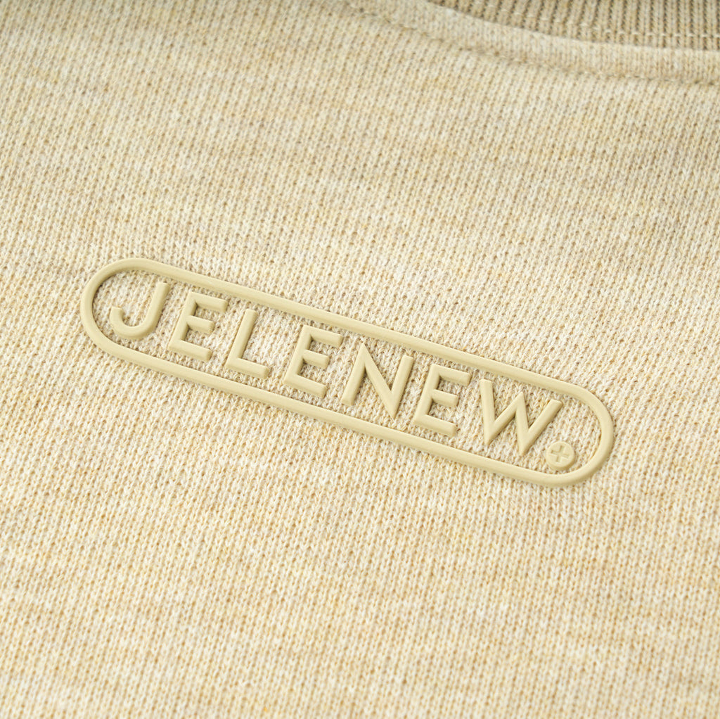 Essentials Cotton Crewneck beige sweatshirt with relaxed fit and comfortable fabric close-up