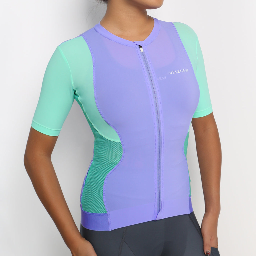 Hourglass Short Sleeve cycling jersey in purple and mint with front zipper and CurveTec technology for women