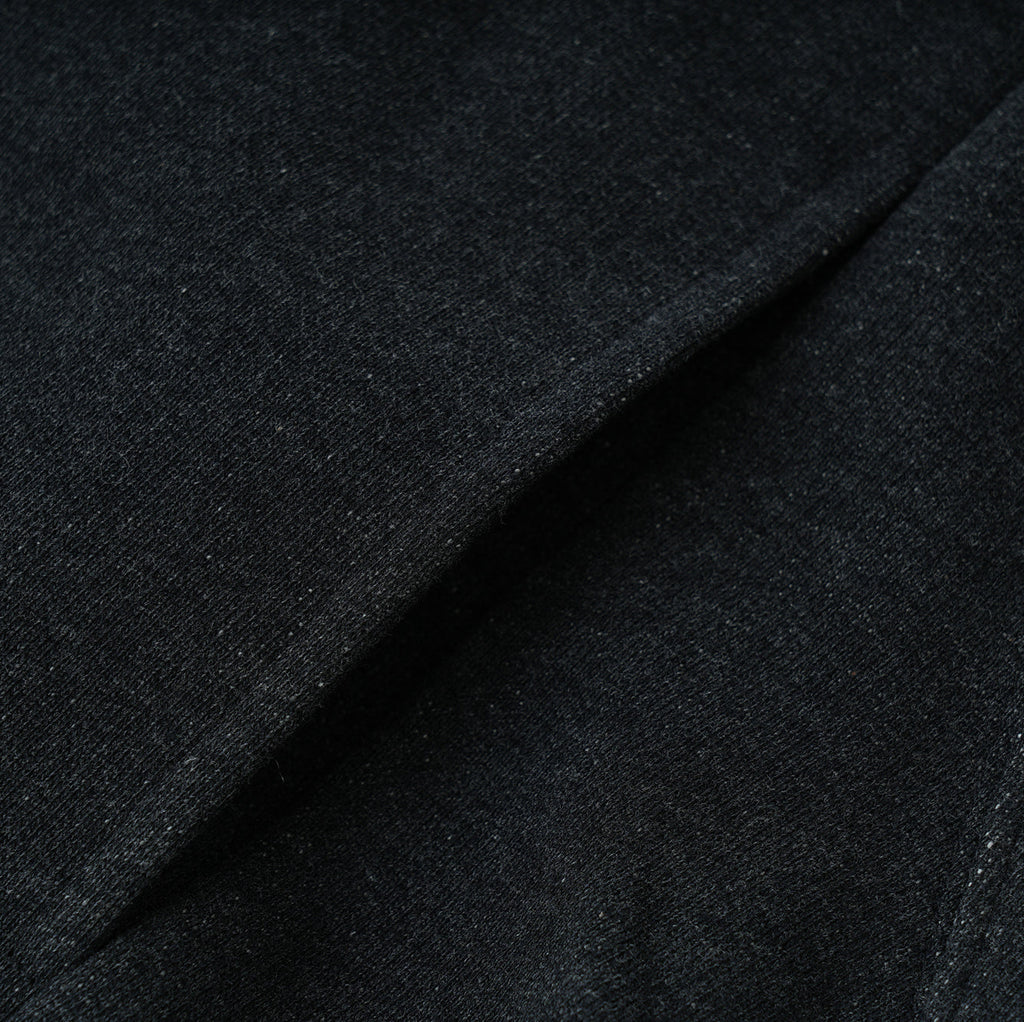 close-up of black Essentials Cotton Crewneck sweatshirt fabric with relaxed fit and comfortable texture